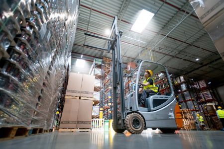 warehouse worker operating forklift